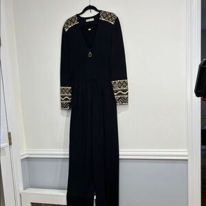 St. John Black Knit Jumpsuit with ElegantGold Detailing on Shoulder and Sleeves
